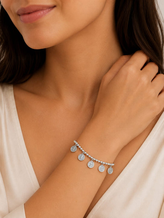 Pulsera con dijes de San Benito en Plata Ley 925